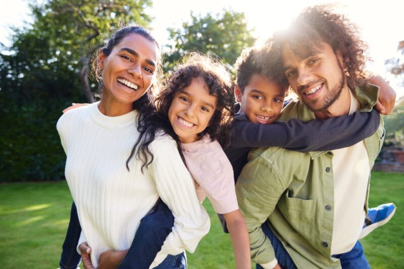 happy family of four outdoors