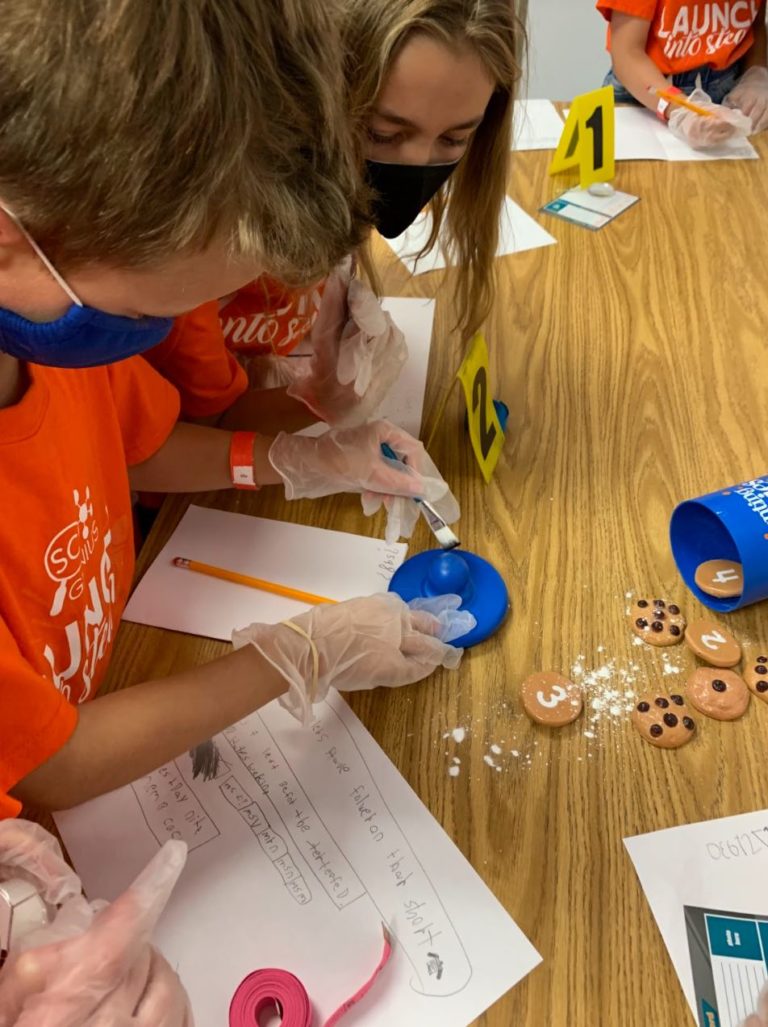 campers doing a forensic activity