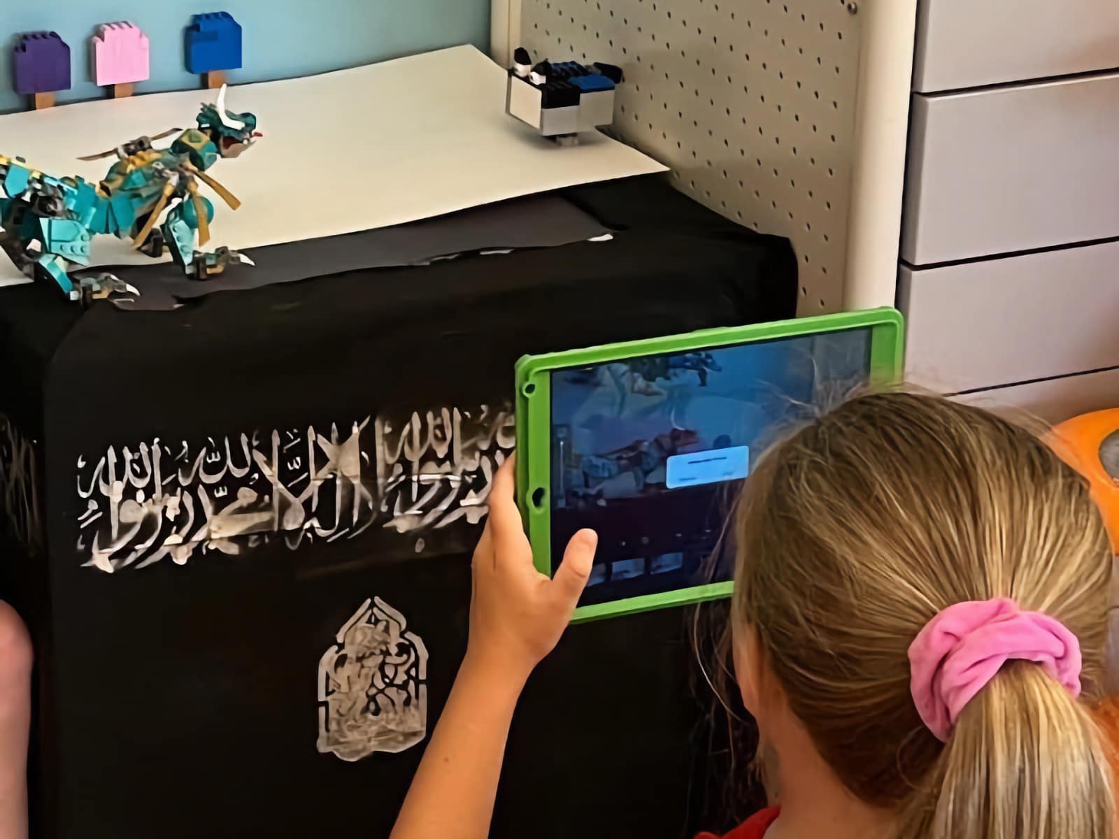 girl using tablet for stop motion project