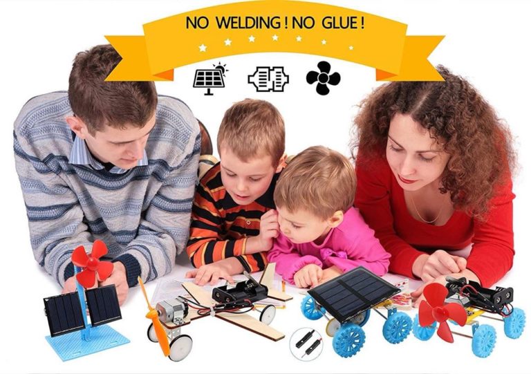 parents and two kids playing with a power electric kit